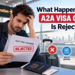 Man holding a rejected A2A visa change document at an airport in the UAE